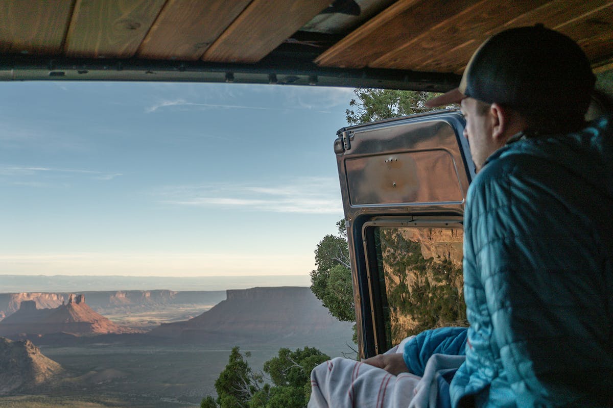 Travis looking out from the back of the van