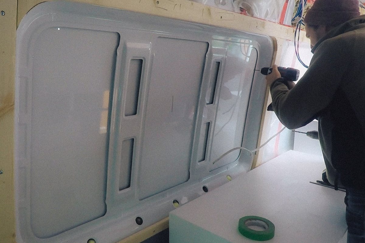 Starting to cut out the van window sprinter van window install