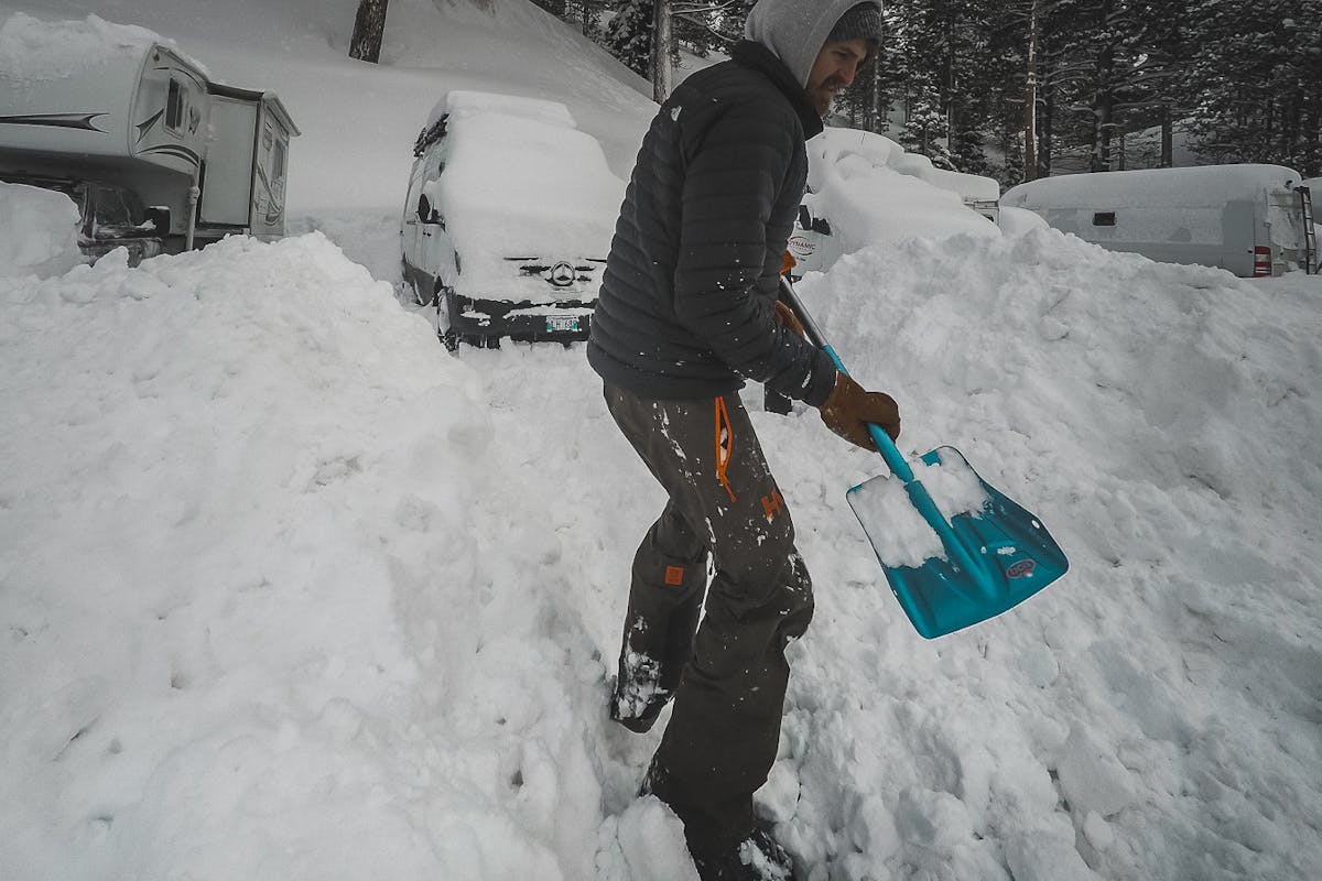 Shovelling the van out of the snow.