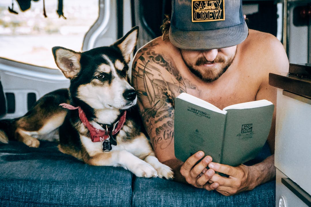 Ellie and Scott reading in the van